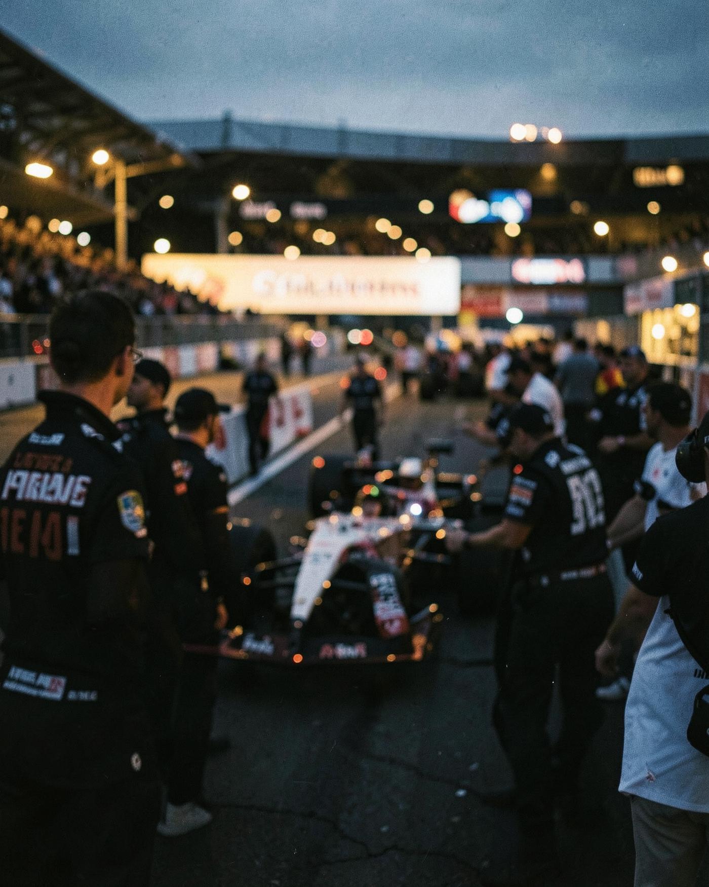 Motorsport paddock at dusk